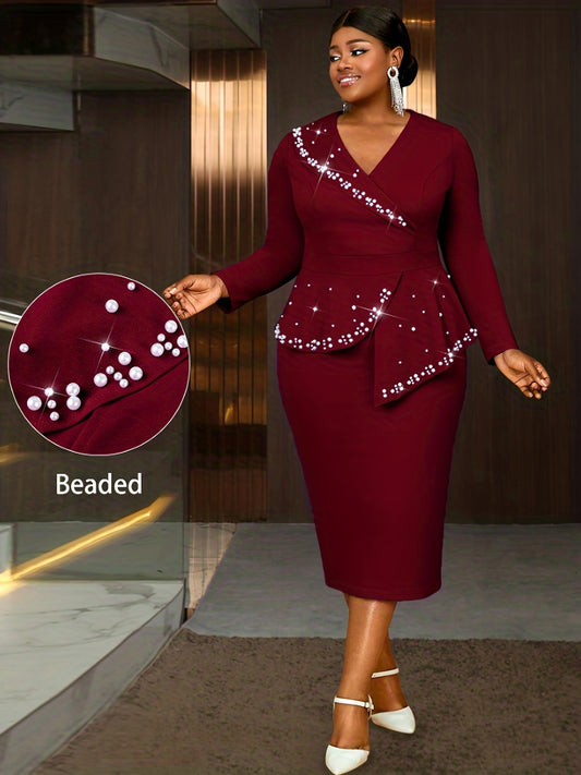 Woman wearing a burgundy dress with beaded details in an indoor setting.