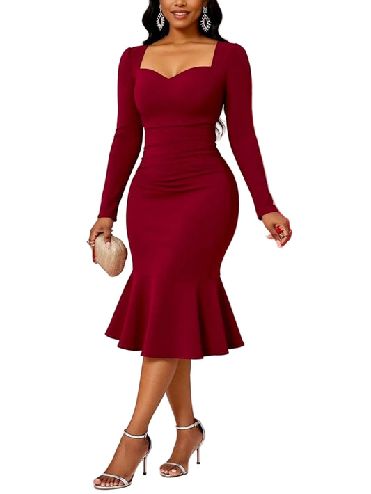 Woman in a red dress standing in front of pink and red balloons