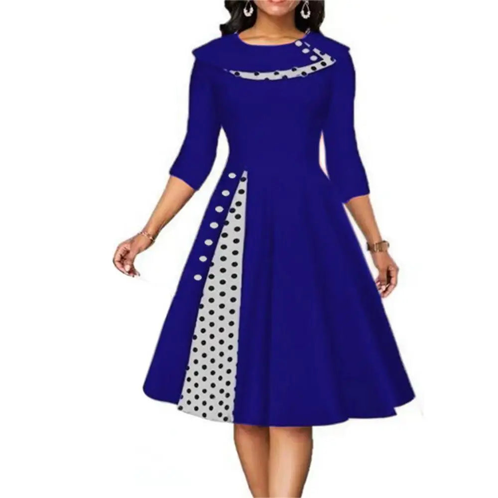 Blue vintage women's swing dress with gray polka dot side panel and turn-down collar