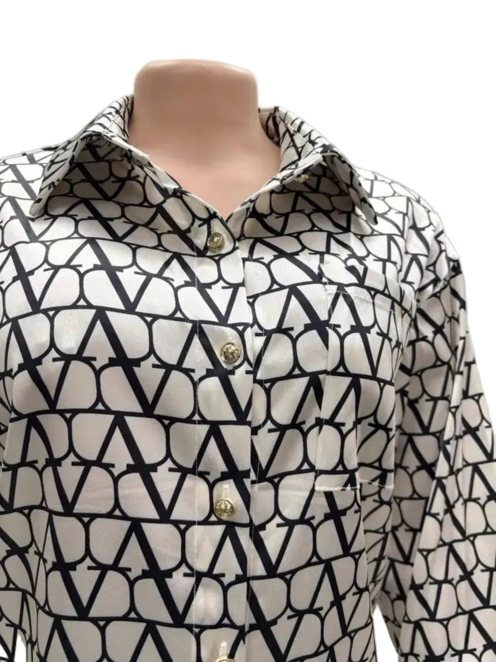 Black and white patterned shirt on a mannequin with 'Joskaa' branding.