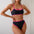 Black bikini with pink trim worn by a model against a white background