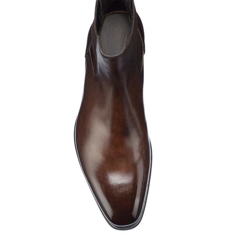 Brown leather boot on a white background