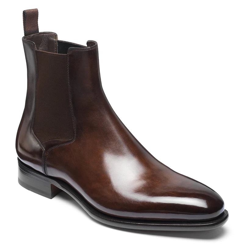 Brown leather Chelsea boot on a white background