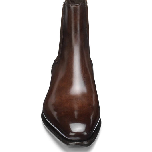 Brown leather boot on a white background