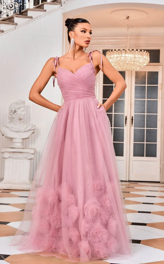 Dusty rose draped V-neck A-line gown with adjustable shoulder ties and clustered floral hem