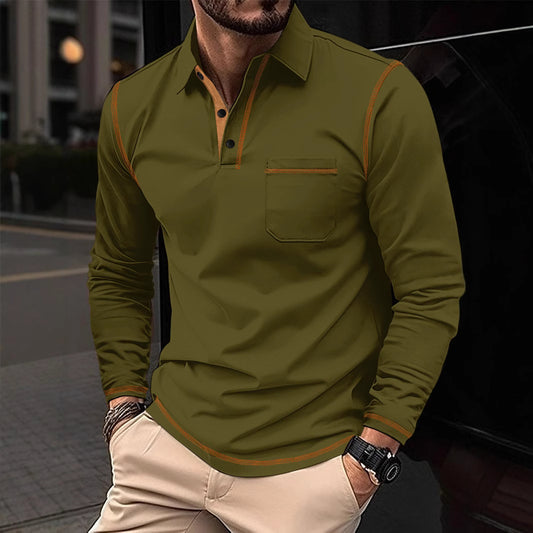 Man wearing a green long-sleeve shirt with brown accents on a blurred street background