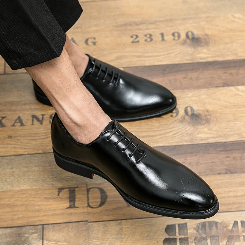 Black dress shoes on a wooden floor