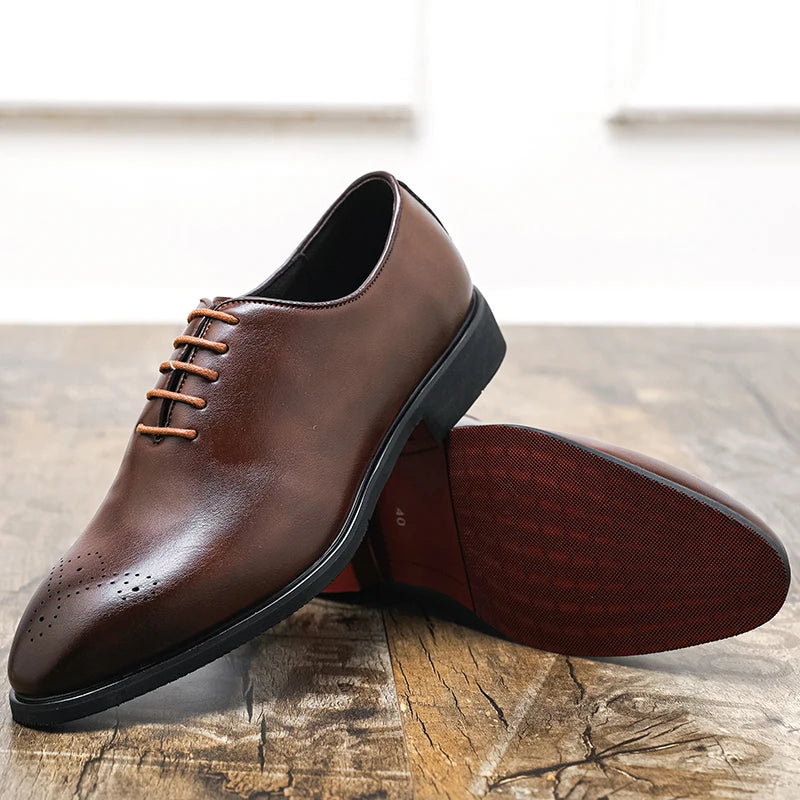 Brown leather dress shoes on a wooden surface