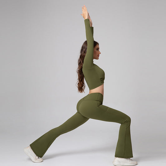 Woman in olive green athletic wear posing against a gray background