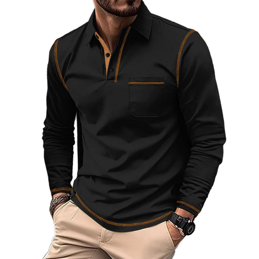 Man wearing a black long-sleeve shirt with brown accents on a blurred street background