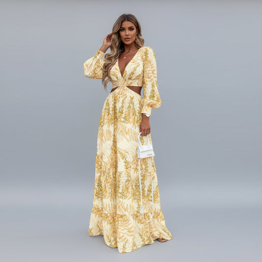 Woman in a long floral dress standing on a street.