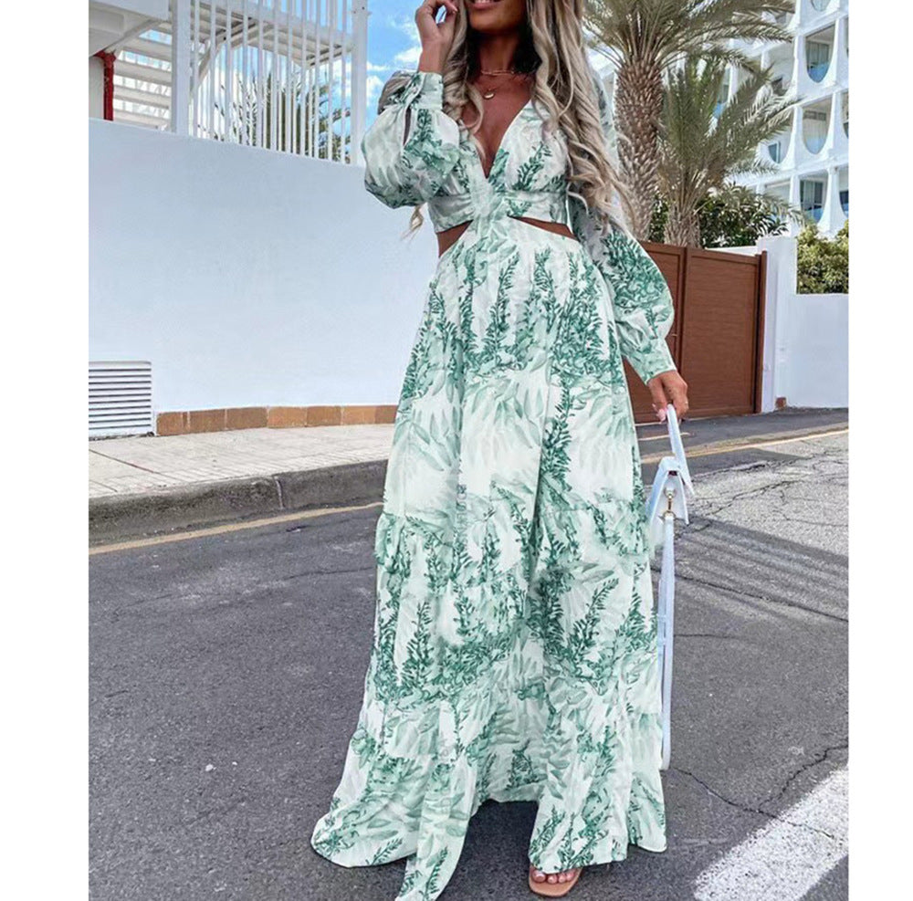 Woman wearing a green floral dress on a street with palm trees in the background