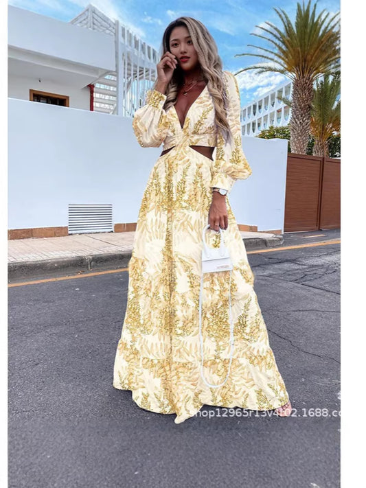 Woman in a gold dress standing on a street with palm trees in the background
