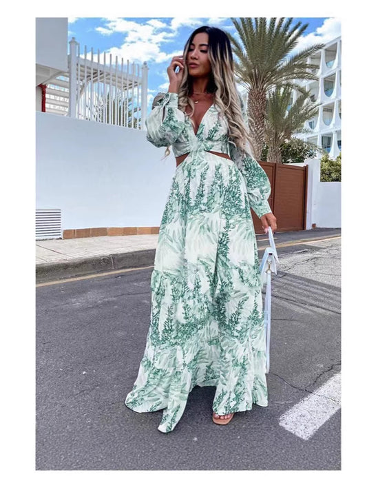 Woman in a green floral dress walking on a street with palm trees in the background