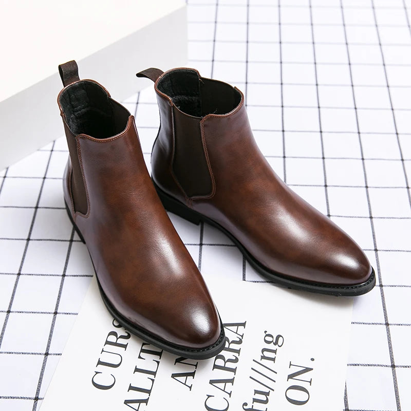 Pair of brown leather Chelsea boots on a white surface with text.