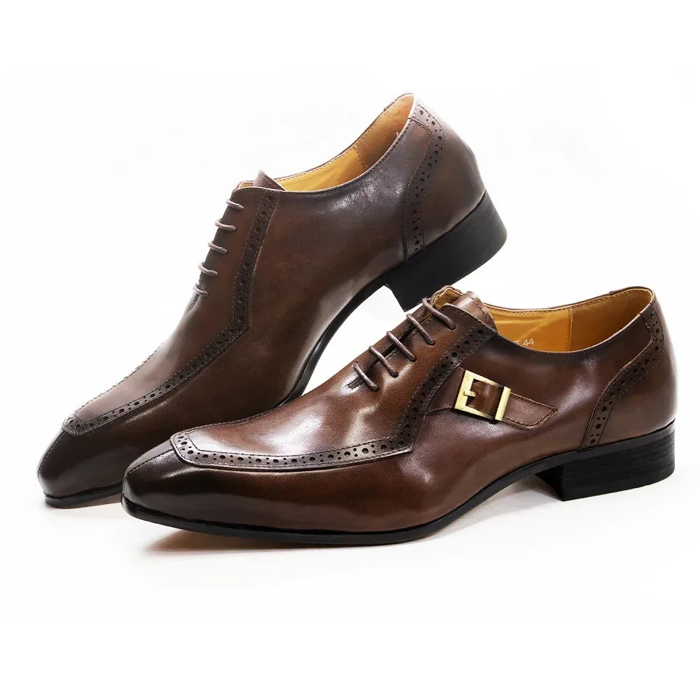 Pair of brown leather dress shoes on a white background
