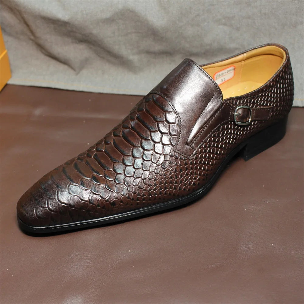 Brown men's wingtip loafer profile showing snakeskin texture and tan lining