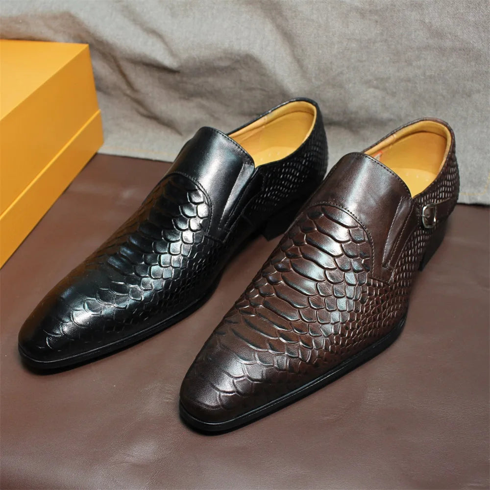 Pair of men's business dress shoes featuring pointed toe and metallic side buckle