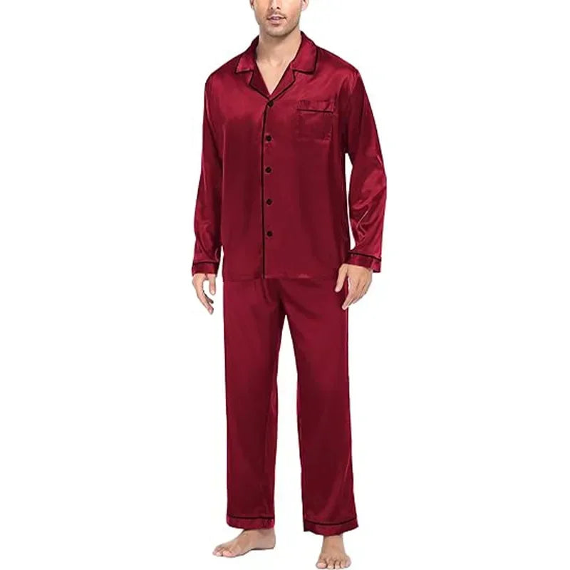 Red satin pajama set worn by a person on a white background