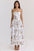 Woman wearing a floral dress on a white background