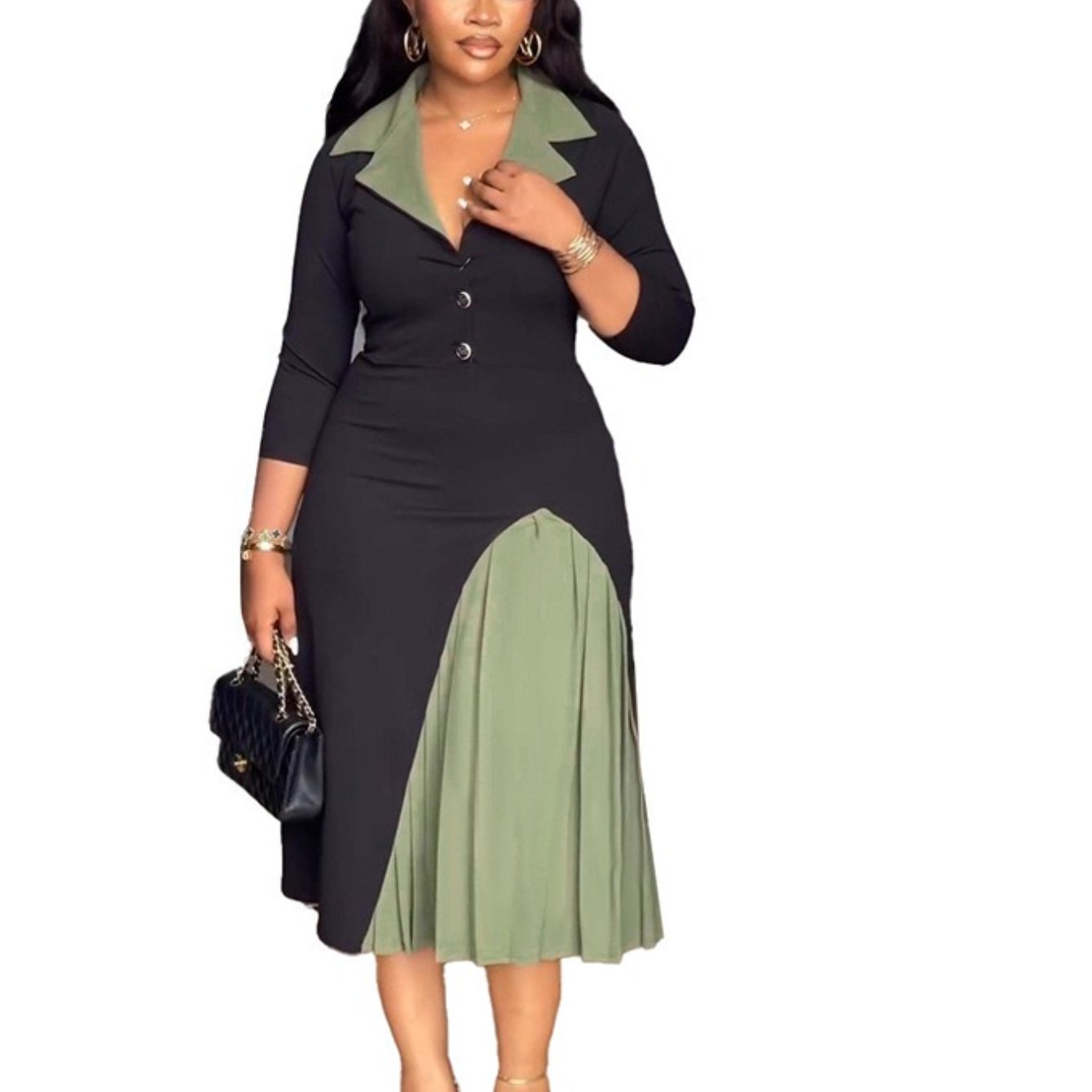 Woman wearing a black and green dress with a white background