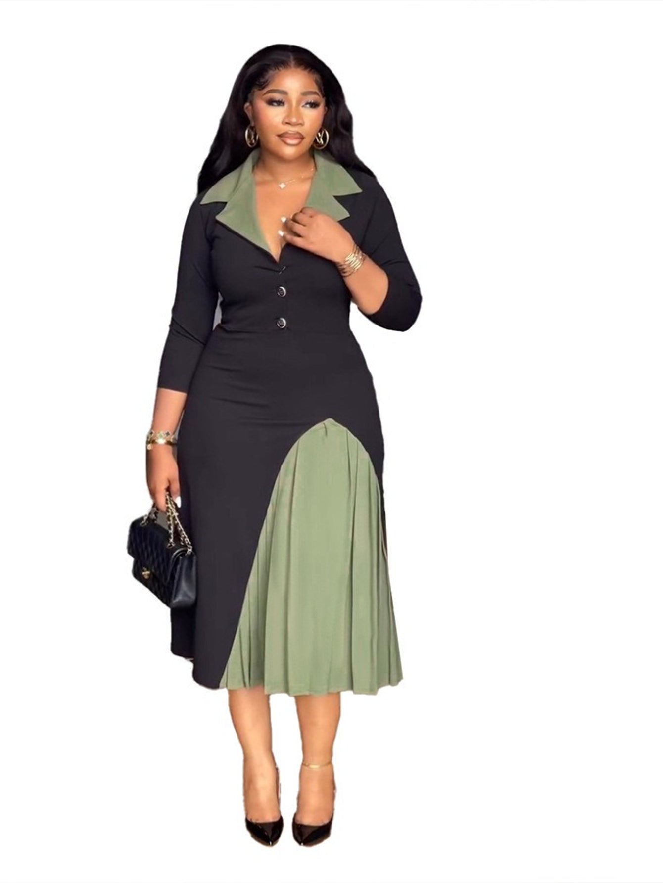 A woman in a black and green dress with a white background