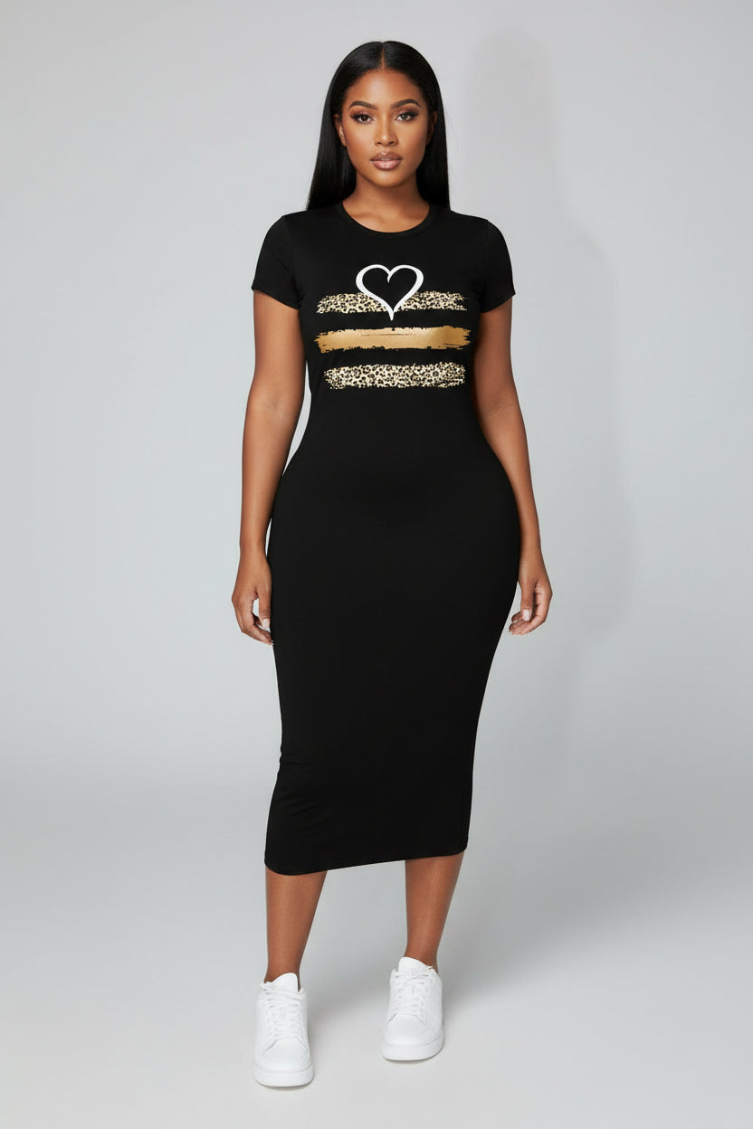 Woman wearing a black dress with a heart design on a city street.