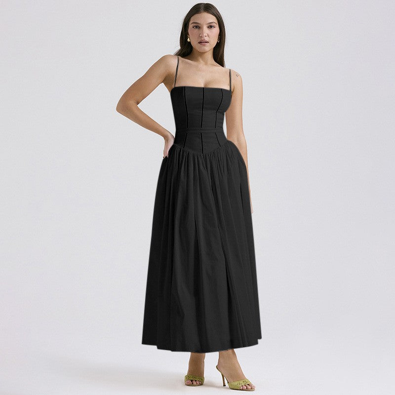 Woman wearing a black strapless dress on a white background