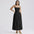 Woman wearing a black strapless dress on a white background