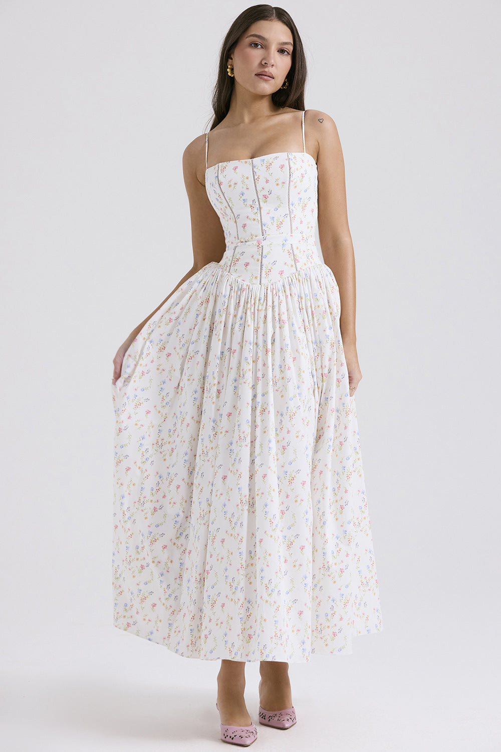 Woman wearing a floral dress on a white background