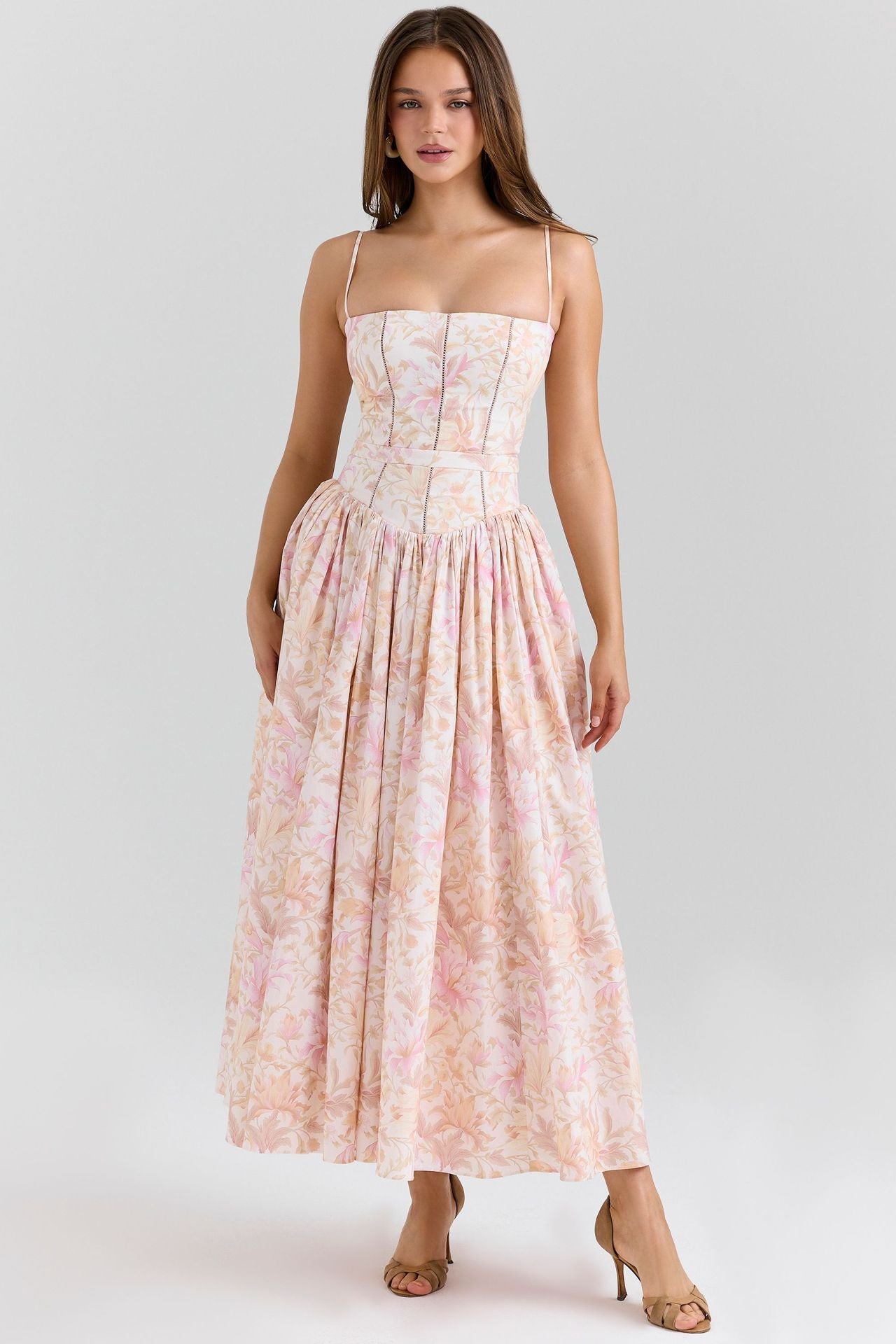 Woman wearing a floral dress on a white background