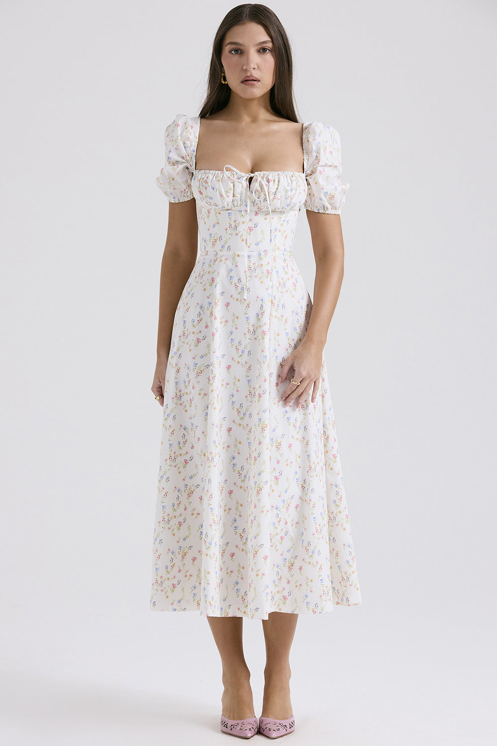 Woman wearing a floral dress on a white background