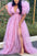 Woman wearing a pink evening gown with puffed sleeves against a green outdoor background