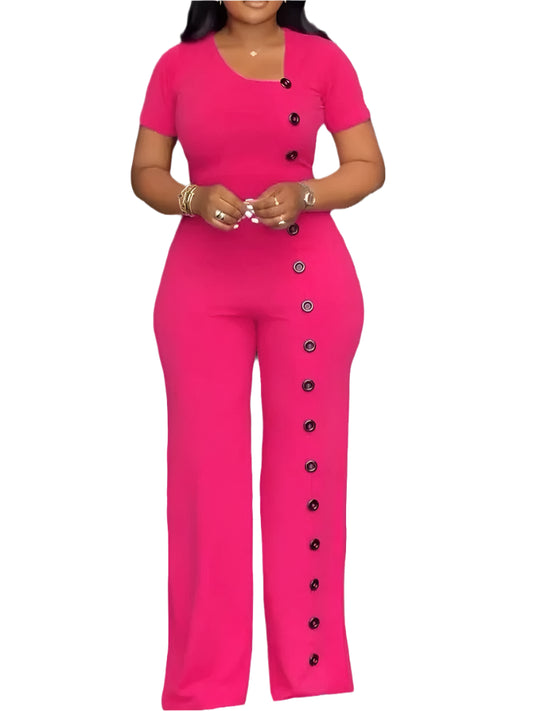Woman wearing a pink jumpsuit with buttons on a white background