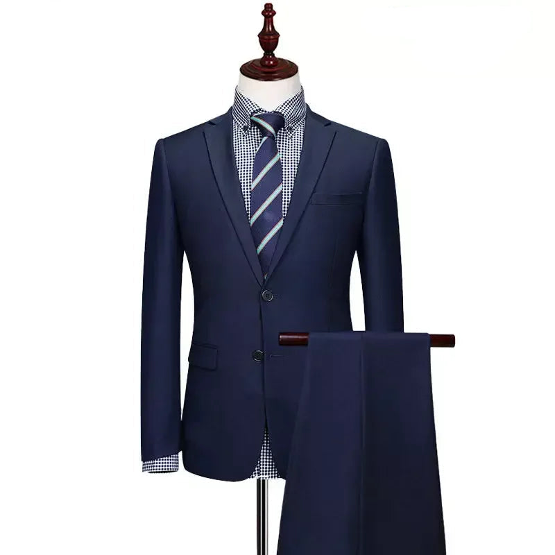 A navy blue men's suit set displayed on a mannequin torso, including a blazer and matching trousers hanging below. The blazer is styled with a blue and white checkered shirt and a striped tie.