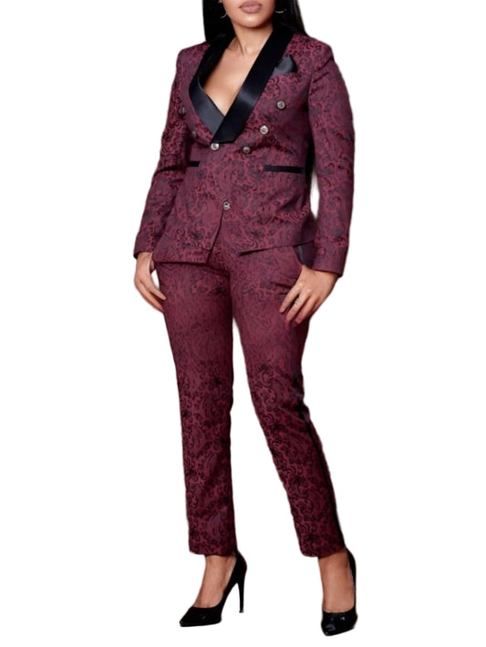 Woman wearing a maroon patterned suit against a brown background