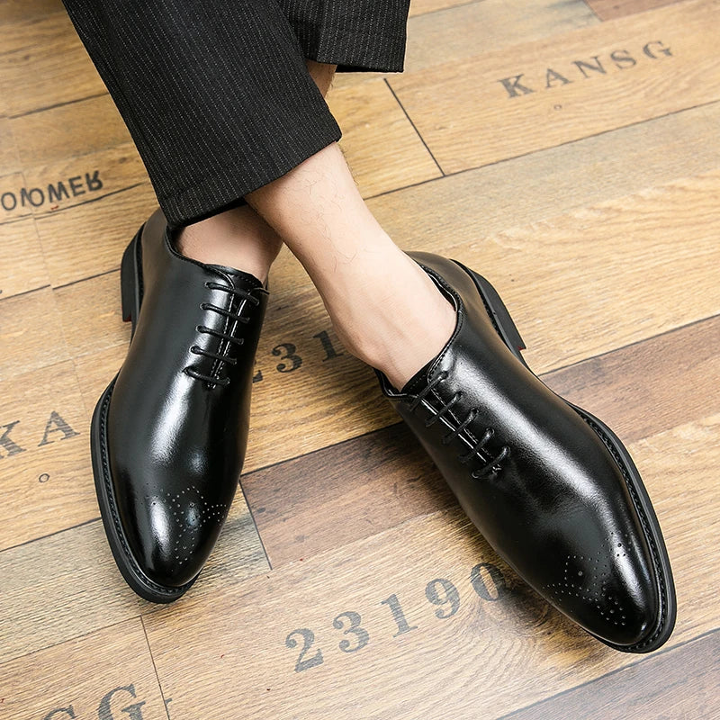 Black dress shoes on a wooden floor