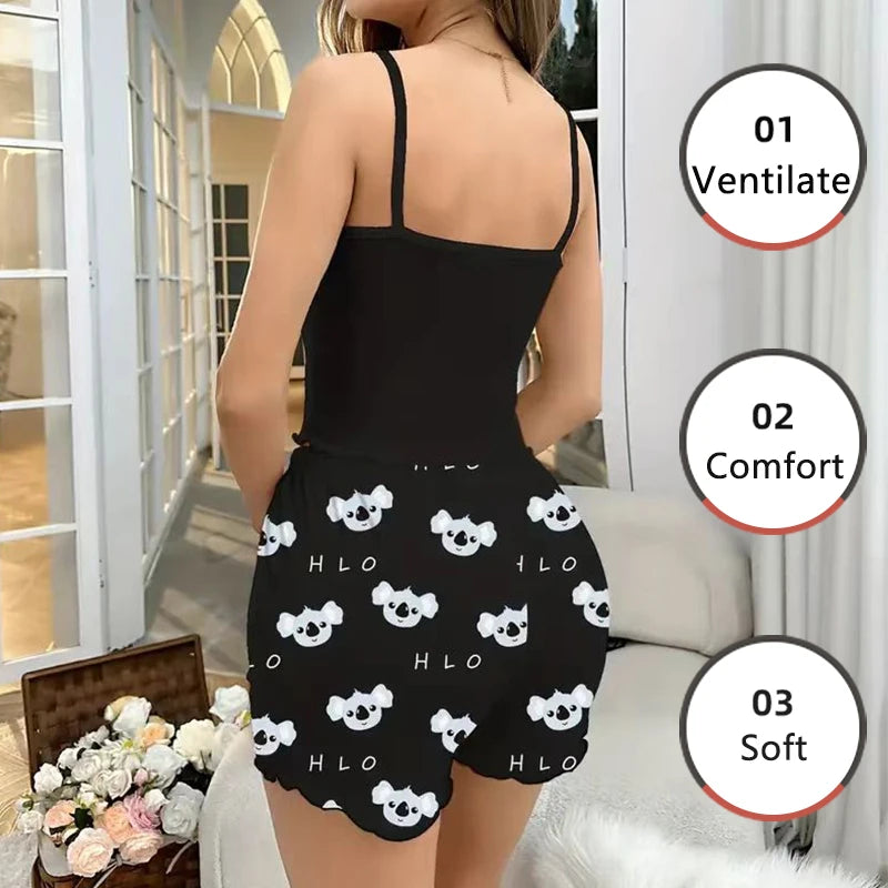 Person wearing a black romper with white patterns in a room with a couch and flowers.
